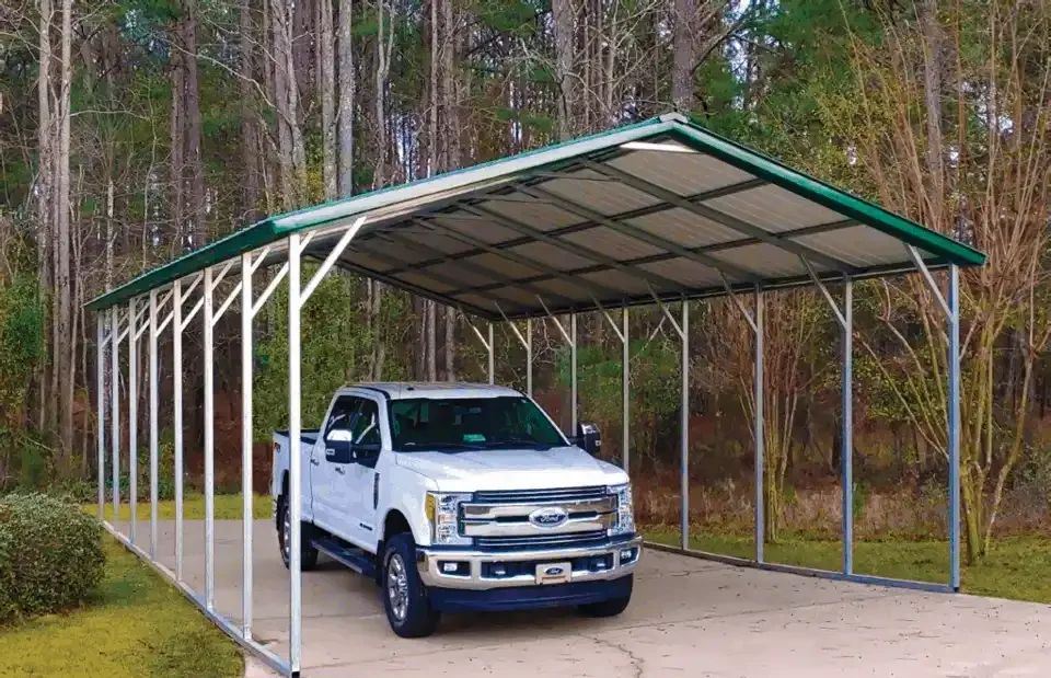 photo of a steel car canopy with a white truck parked underneath